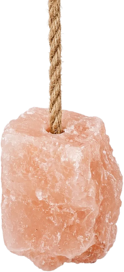 Pink Himalayan salt lick hanging on a jute rope